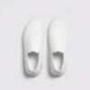 slip-on quilted sock sneakers - lace-free everyday shoes with a cushioned thick sole and heel window in white, top-down view of the pair on a light gray background