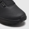 boa closure hiking sneakers in black, close-up view of the toe on a light gray background