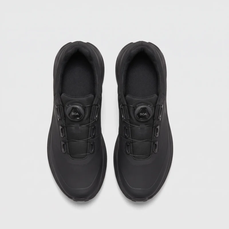 boa closure hiking sneakers in black, top-down view of the pair on a light gray background