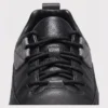 chunky sole leather casual sneakers in black, close-up view of the closure on a light gray background