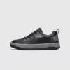 chunky sole leather casual sneakers in black, right side profile view on a light gray background