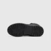 high-top leather boots in black, outsole tread view on a light gray background