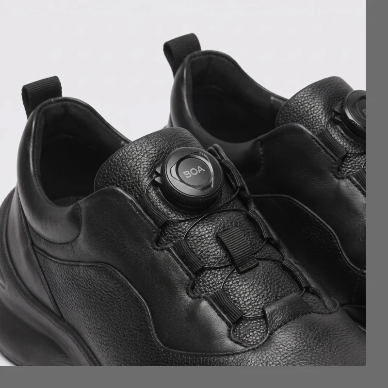 lightweight boa walking sneakers in black, detail view on a light gray background