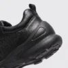 lightweight boa walking sneakers in black, close-up view of the heel on a light gray background