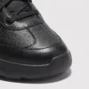 lightweight boa walking sneakers in black, close-up view of the toe on a light gray background