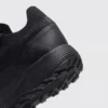 lightweight trail running sneakers in black, close-up view of the heel on a light gray background