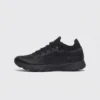 lightweight trail running sneakers in black, right side profile view on a light gray background