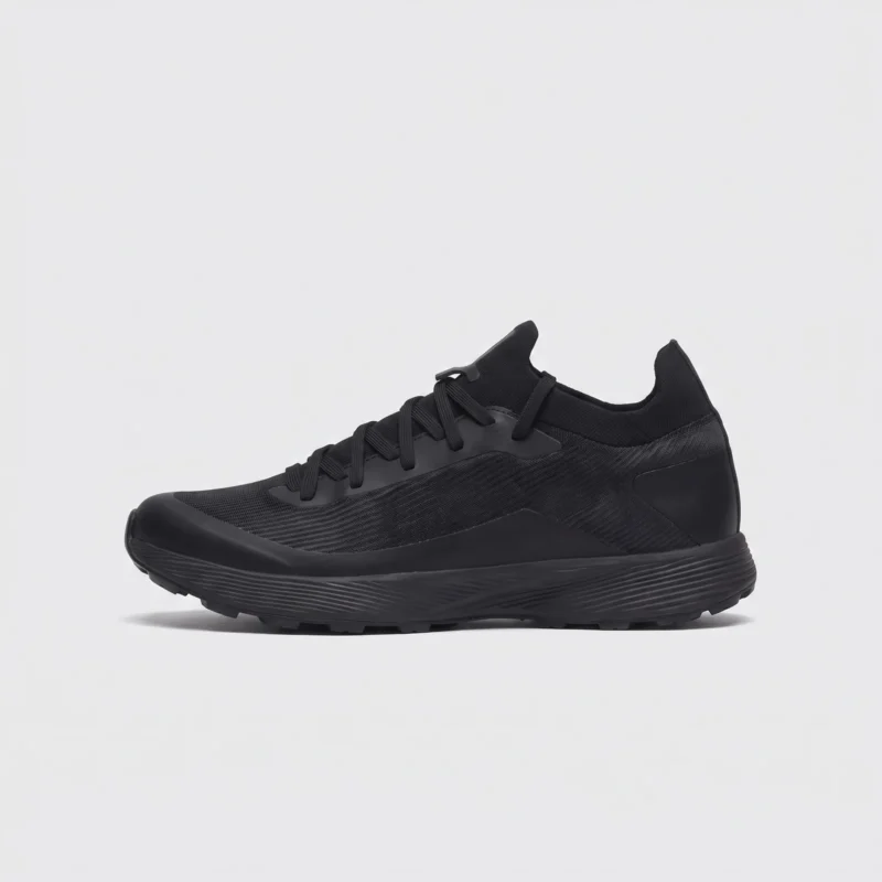 lightweight trail running sneakers in black, right side profile view on a light gray background
