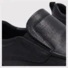 slip-on leather casual shoes in black, detail view on a light gray background