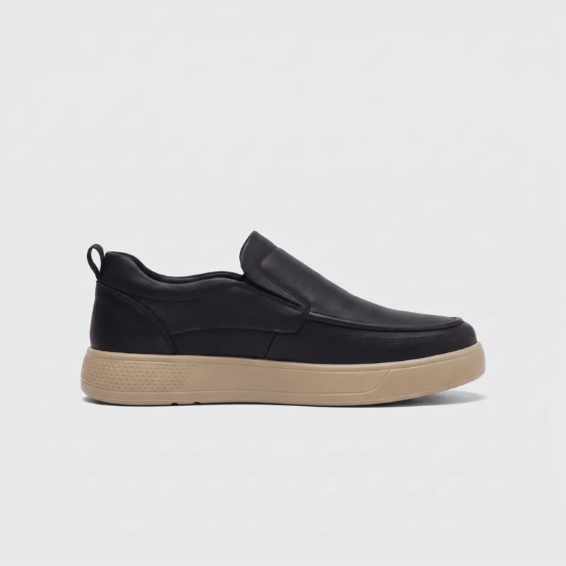 slip-on leather casual shoes in black, left side profile view on a light gray background