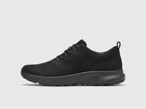 waterproof leather hiking sneakers in black, left side profile view on a light gray background
