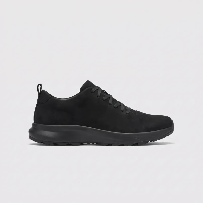 waterproof leather hiking sneakers in black, right side profile view on a light gray background