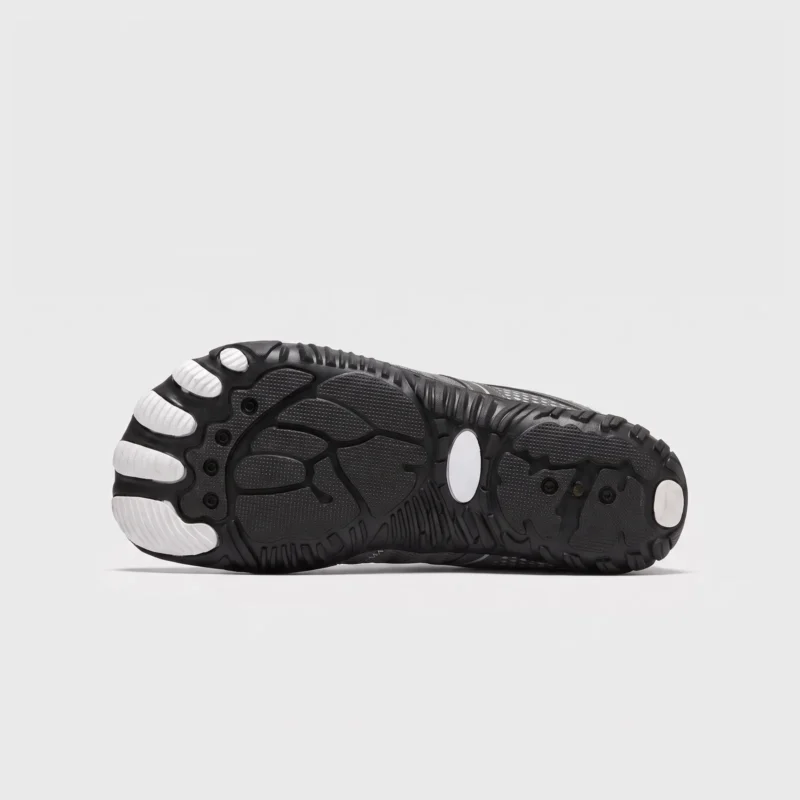 barefoot aqua water shoes quick-dry for beach wading hiking surfing in gray, outsole tread view on a light gray background