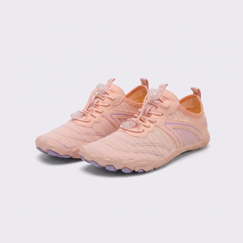 barefoot aqua water shoes quick-dry for beach wading hiking surfing in pink, front 45-degree view of the pair on a light gray background
