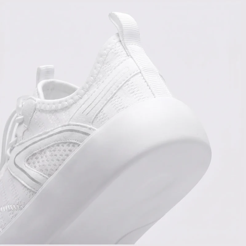 barefoot aqua water shoes quick-dry for beach wading hiking surfing in white, close-up view of the heel on a light gray background