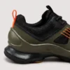 breathable mesh running sneakers lightweight chunky sole casual outdoor shoes in green, close-up view of the heel on a light gray background