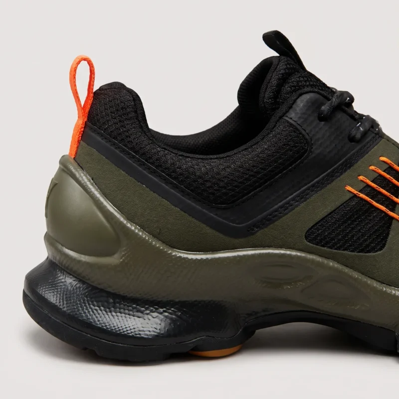 breathable mesh running sneakers lightweight chunky sole casual outdoor shoes in green, close-up view of the heel on a light gray background