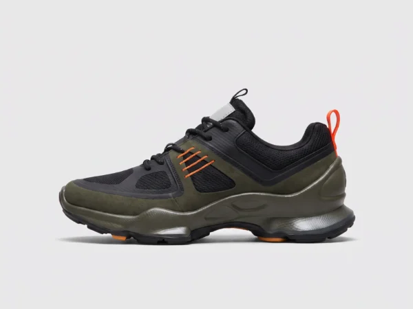breathable mesh running sneakers lightweight chunky sole casual outdoor shoes in green, left side profile view on a light gray background