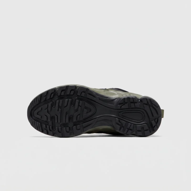 breathable mesh running sneakers lightweight chunky sole casual outdoor shoes in green, outsole tread view on a light gray background