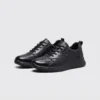 genuine leather casual shoes breathable lightweight non-slip walking sneakers in black, front 45-degree view of the pair on a light gray background