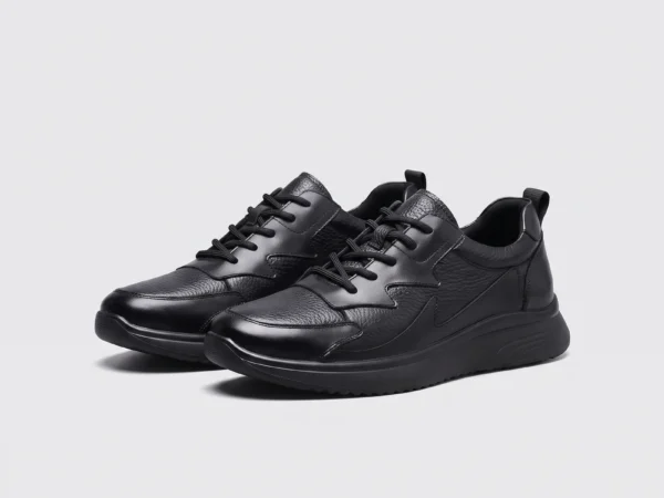genuine leather casual shoes breathable lightweight non-slip walking sneakers in black, front 45-degree view of the pair on a light gray background