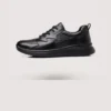 genuine leather casual shoes breathable lightweight non-slip walking sneakers in black, left side profile view on a light gray background