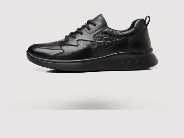 genuine leather casual shoes breathable lightweight non-slip walking sneakers in black, left side profile view on a light gray background