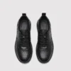 genuine leather casual shoes breathable lightweight non-slip walking sneakers in black, top-down view of the pair on a light gray background