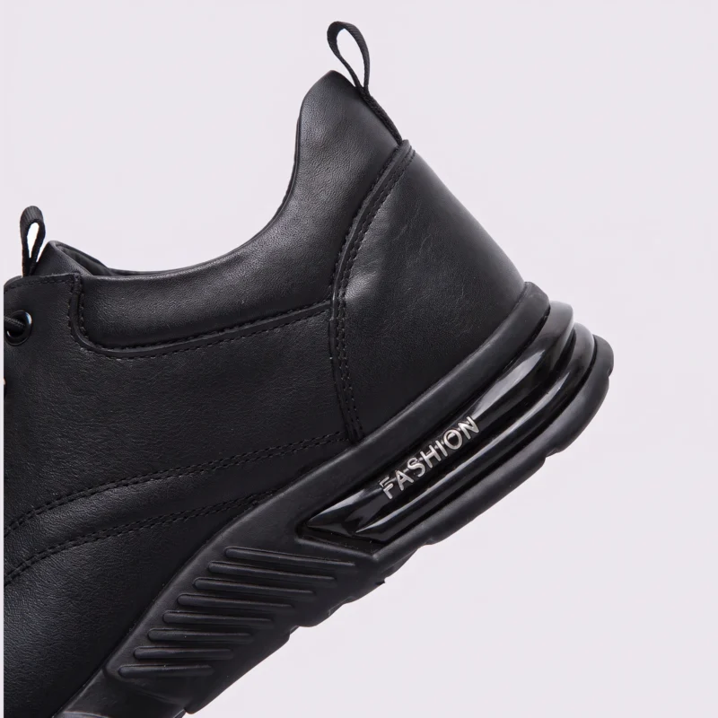 genuine leather lace-up casual sneakers warm comfortable in black, close-up view of the heel on a light gray background