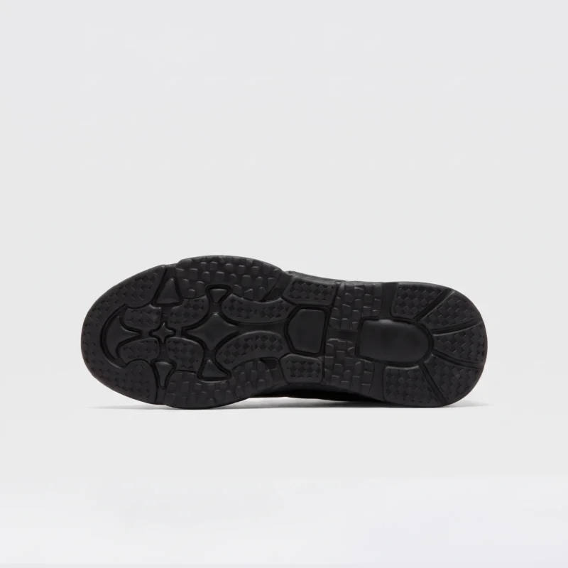 genuine leather lace-up casual sneakers warm comfortable in black, outsole tread view on a light gray background