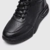 genuine leather lace-up casual sneakers warm comfortable in black, close-up view of the toe on a light gray background
