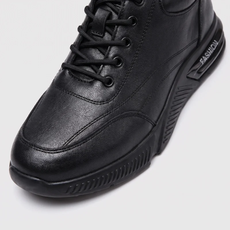 genuine leather lace-up casual sneakers warm comfortable in black, close-up view of the toe on a light gray background