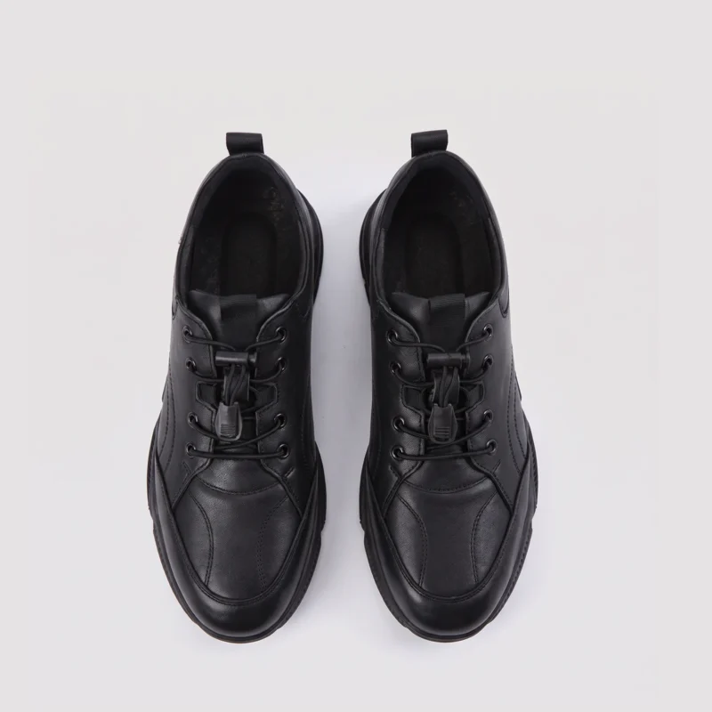 genuine leather lace-up casual sneakers warm comfortable in black, top-down view of the pair on a light gray background