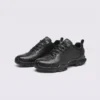 genuine leather business casual sneakers lightweight comfortable non-slip walking shoes in black, front 45-degree view of the pair on a light gray background