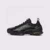 genuine leather business casual sneakers lightweight comfortable non-slip walking shoes in black, left side profile view on a light gray background
