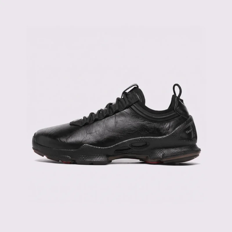 genuine leather business casual sneakers lightweight comfortable non-slip walking shoes in black, left side profile view on a light gray background