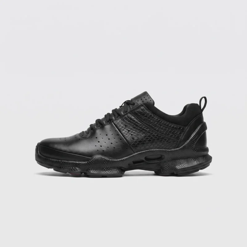 genuine leather business casual sneakers lightweight comfortable non-slip walking shoes in black, right side profile view on a light gray background
