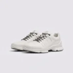 genuine leather business casual sneakers lightweight comfortable non-slip walking shoes in ivory, front 45-degree view of the pair on a light gray background