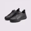 genuine leather business casual running sneakers in black, front 45-degree view of the pair on a light gray background