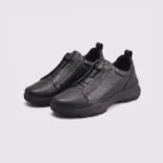 genuine leather business casual running sneakers in black, front 45-degree view of the pair on a light gray background