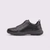 genuine leather business casual running sneakers in black, left side profile view on a light gray background