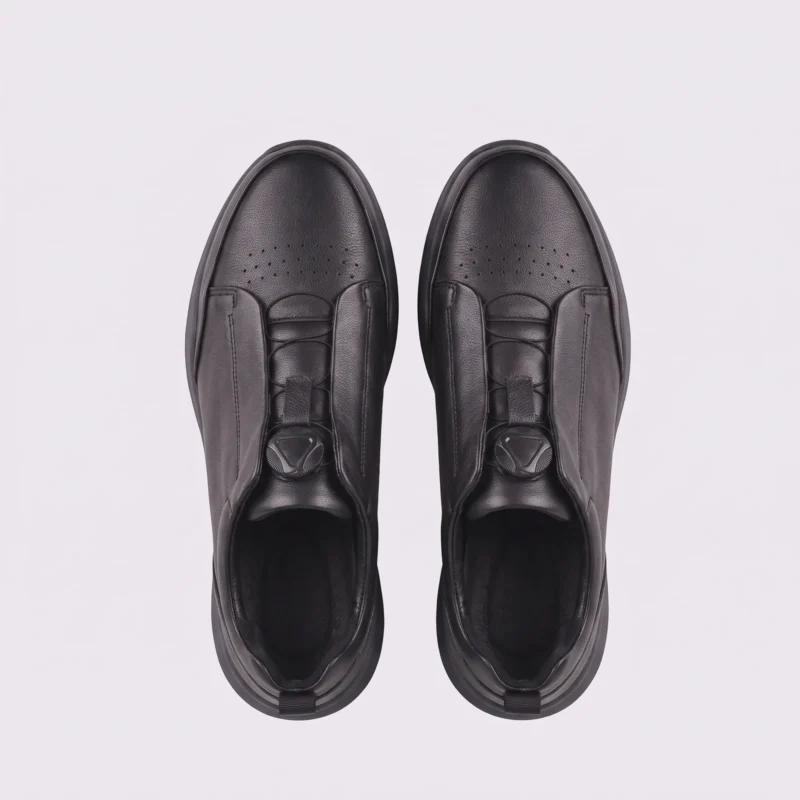 genuine leather business casual running sneakers in black, top-down view of the pair on a light gray background