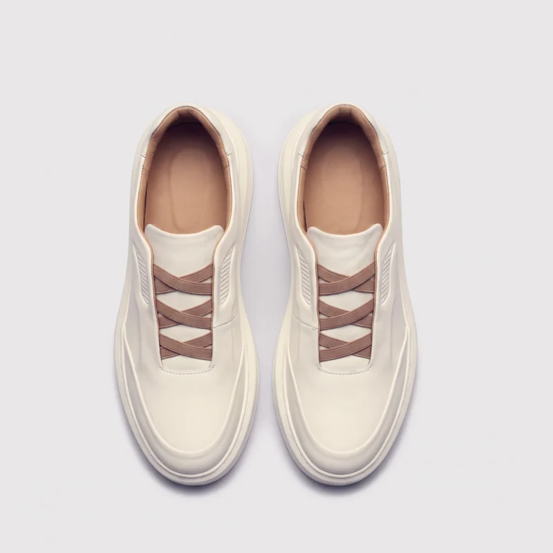 genuine leather platform sneakers, top-down view of the pair on a light gray background