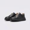genuine leather platform sneakers in black, front 45-degree view of the pair on a light gray background