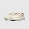 genuine leather platform sneakers in white, front 45-degree view of the pair on a light gray background
