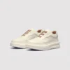 genuine leather platform sneakers in white, front 45-degree view of the pair on a light gray background