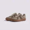 retro platform german trainer sneakers in brown, front 45-degree view of the pair on a light gray background