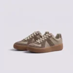 retro platform german trainer sneakers in brown, front 45-degree view of the pair on a light gray background