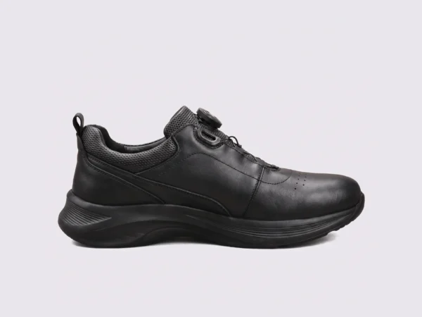 genuine leather rotating dial casual sneakers breathable lightweight in black, left side profile view on a light gray background