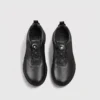 genuine leather rotating dial casual sneakers breathable lightweight in black, top-down view of the pair on a light gray background